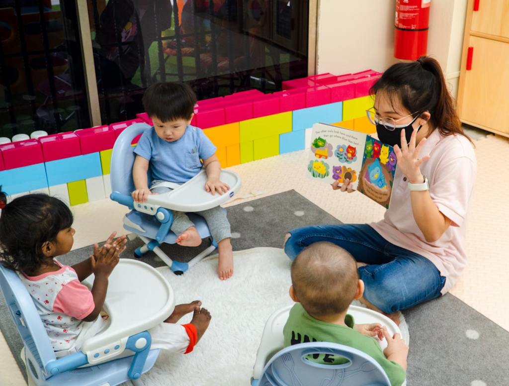 Children at a clean, bright preschool classroom