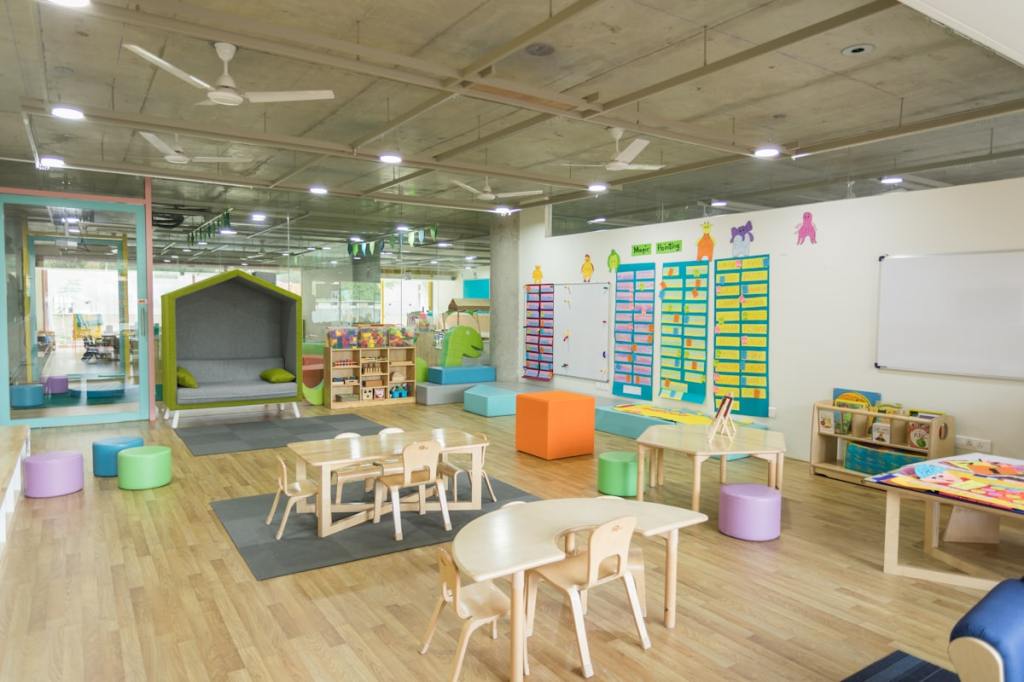 Children at a clean, bright preschool classroom