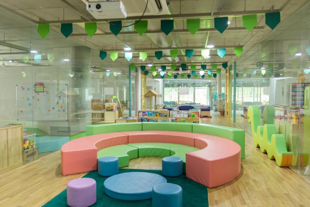 Children at a clean, bright preschool classroom