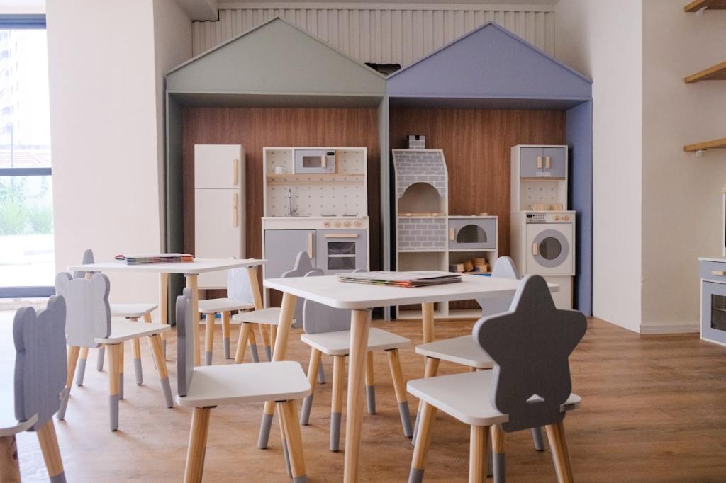 Children at a clean, bright preschool classroom