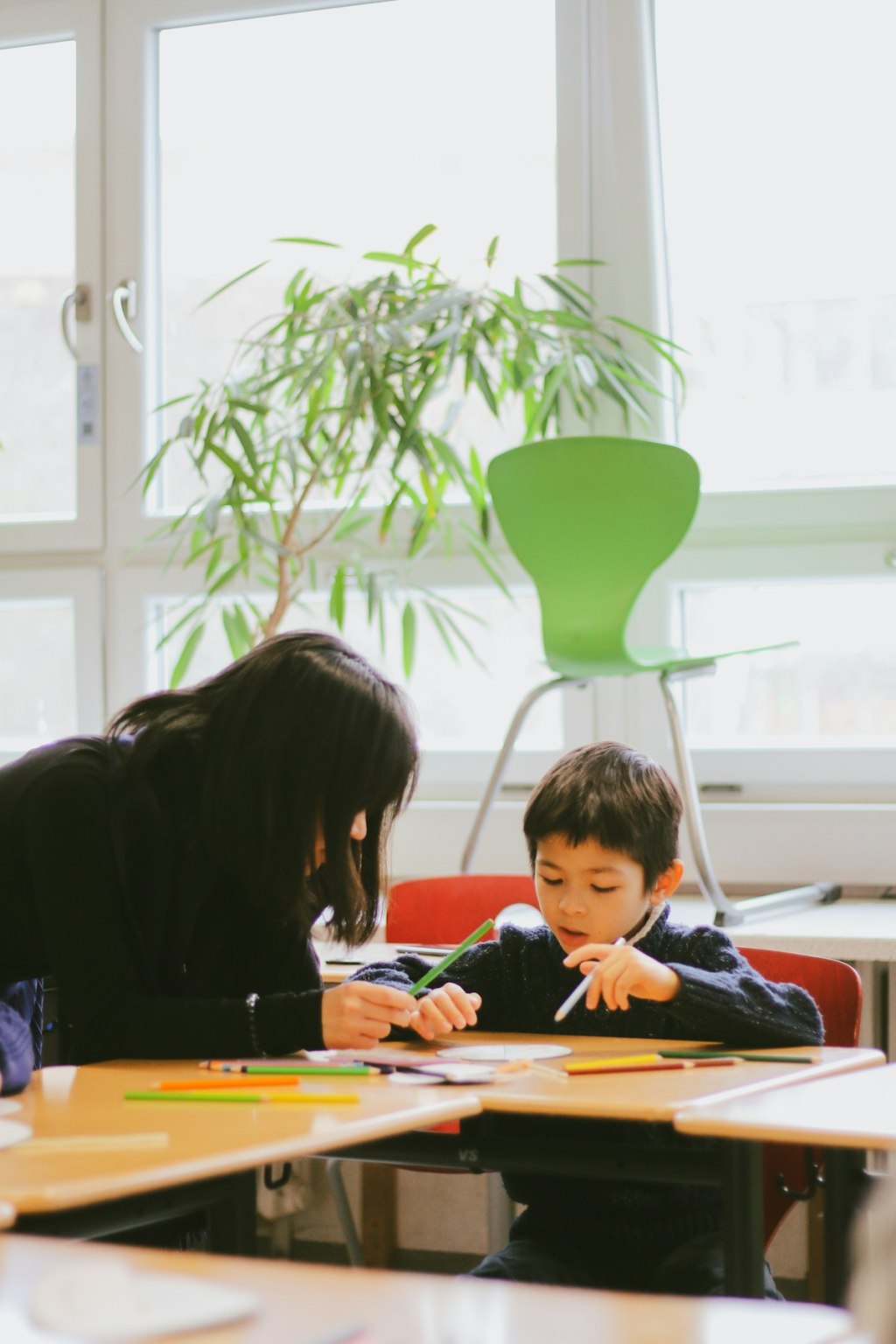 Children at a clean, bright preschool classroom